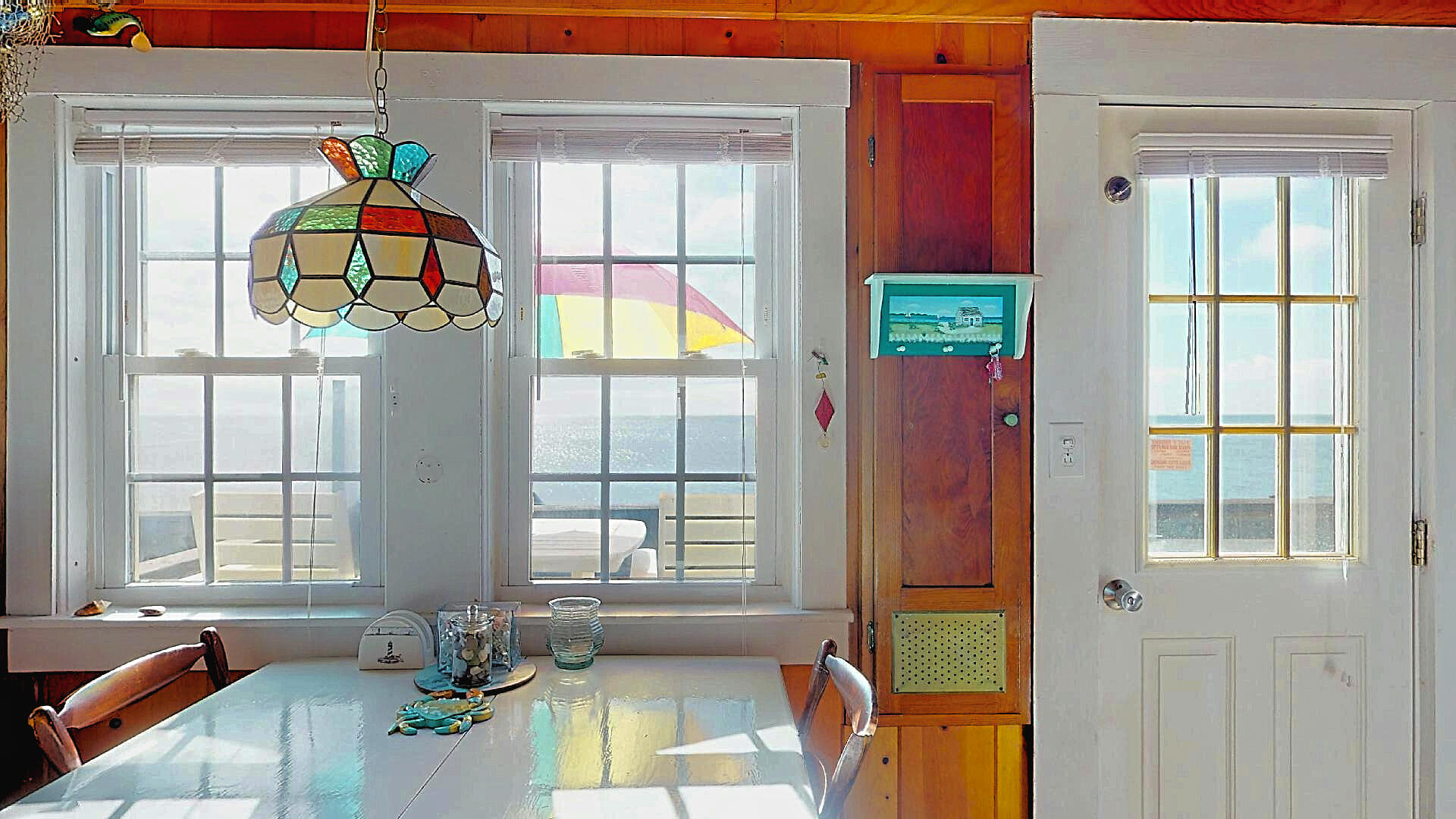 334 Shore Road, Unit 11 Truro, MA 02666 - Photo 12 of 26 a living room filled with furniture and a window
