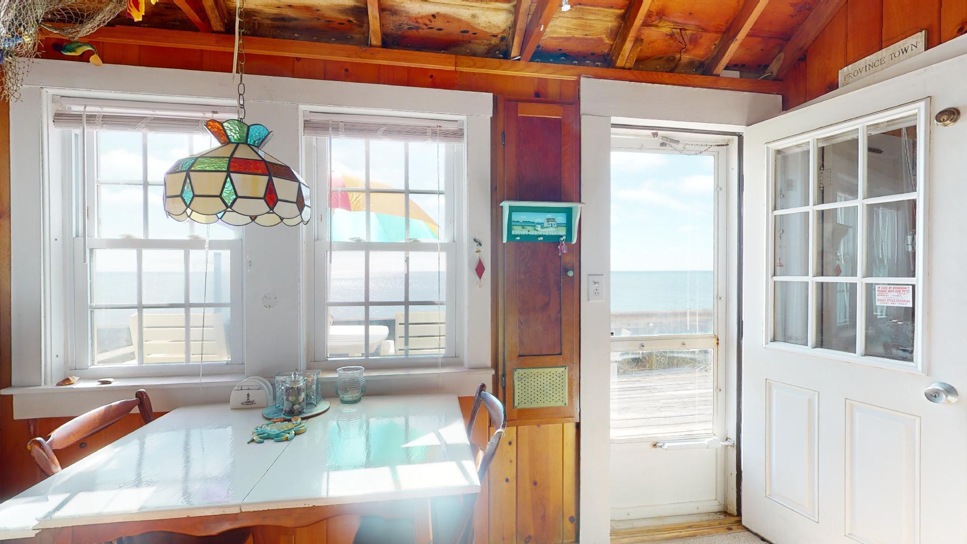 334 Shore Road, Unit 11 Truro, MA 02666 - Photo 14 of 26 a dining room with a window