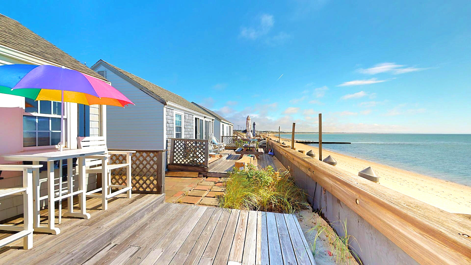 334 Shore Road, Unit 11 Truro, MA 02666 - Photo 2 of 26 a view of balcony with two chairs and wooden floor