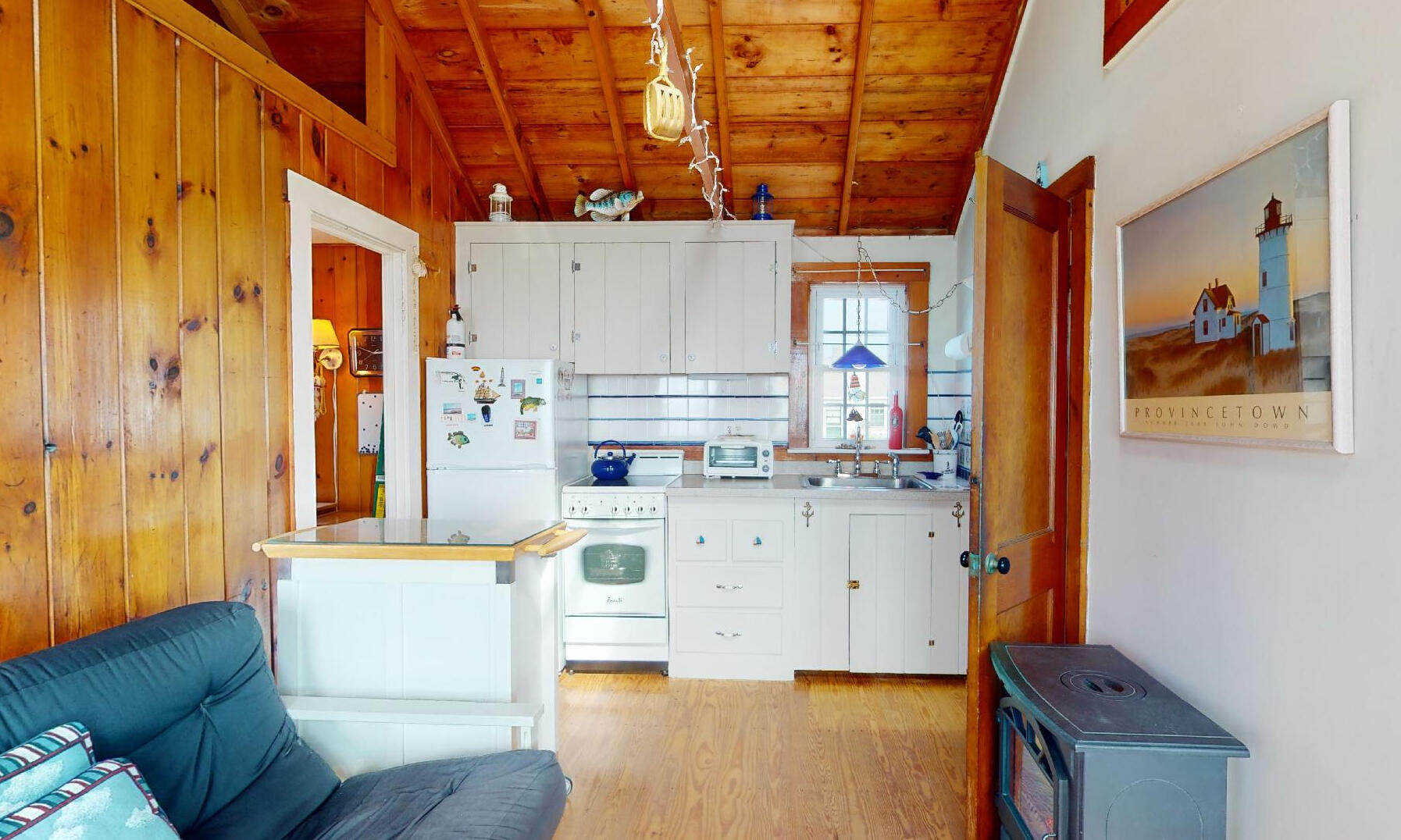 334 Shore Road, Unit 11 Truro, MA 02666 - Photo 3 of 26 a living room with stainless steel appliances kitchen island granite countertop furniture and a fireplace