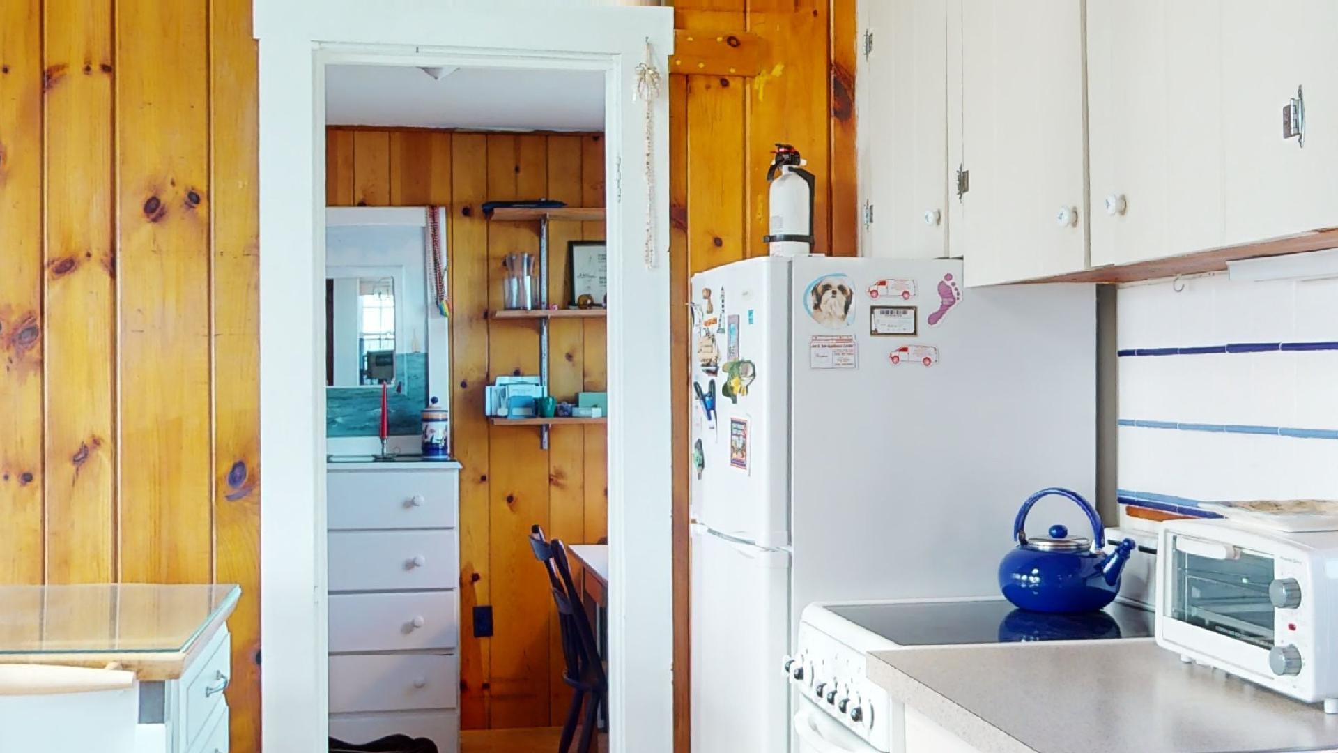 334 Shore Road, Unit 11 Truro, MA 02666 - Photo 6 of 26 a bathroom with a tub sink and mirror