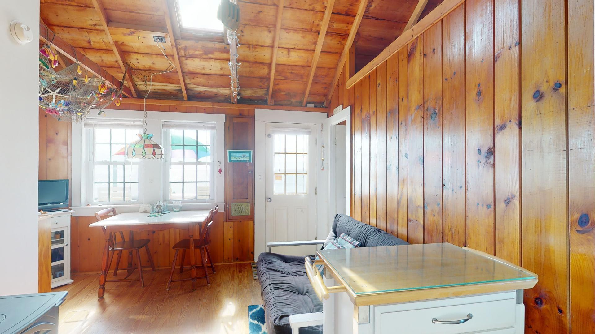 334 Shore Road, Unit 11 Truro, MA 02666 - Photo 9 of 26 a room with pool table and windows