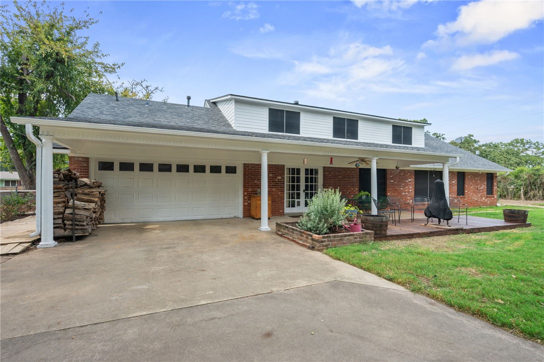 503 Calvert Street Hearne, TX 77859 - Photo 24 of 30 Traditional home featuring brick siding, concrete driveway, a shingled roof, a garage, and a front yard