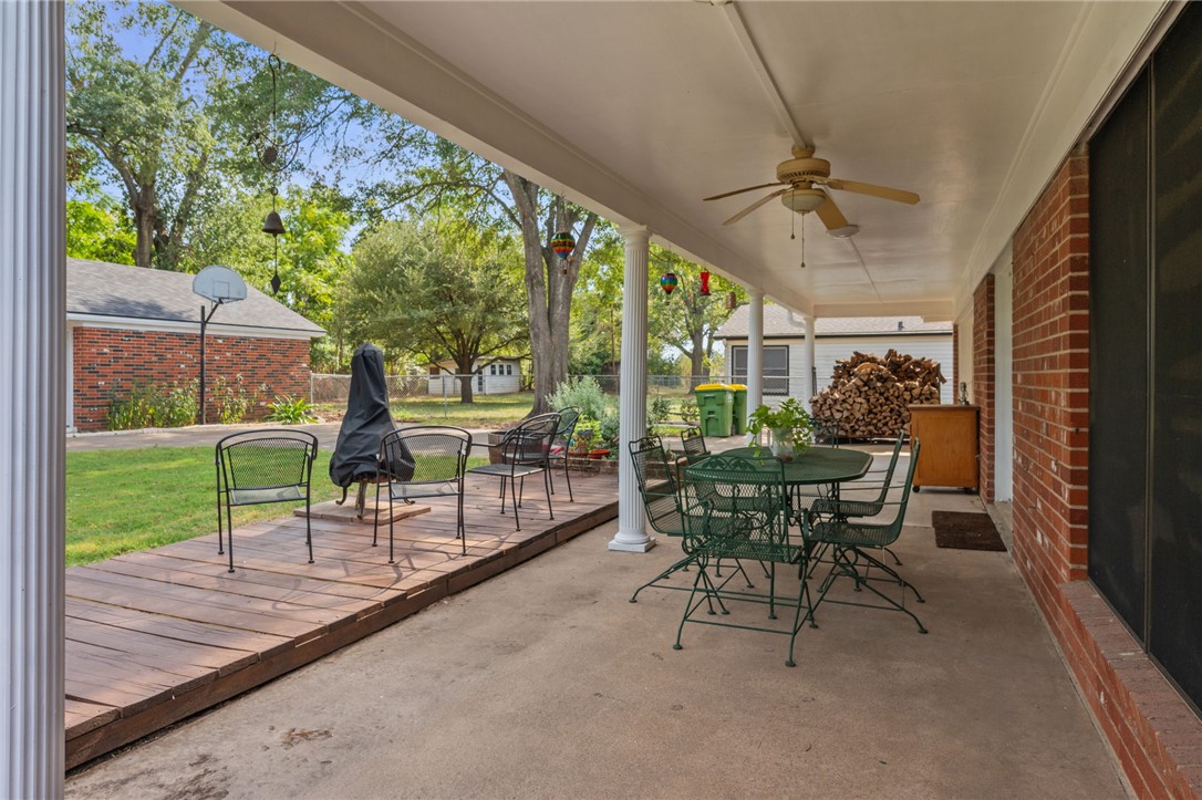 503 Calvert Street Hearne, TX 77859 - Photo 28 of 30 View of patio featuring outdoor dining area and a ceiling fan