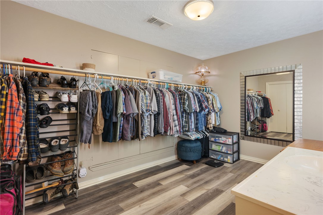 503 Calvert Street Hearne, TX 77859 - Photo 10 of 30 Walk in closet featuring wood finished floors