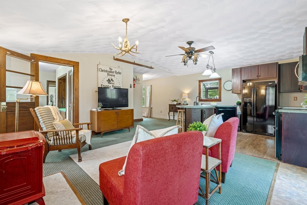 44 Shawsheen Road Billerica, MA 01821 - Photo 16 of 39 a view of a livingroom with furniture a livingroom and chandelier