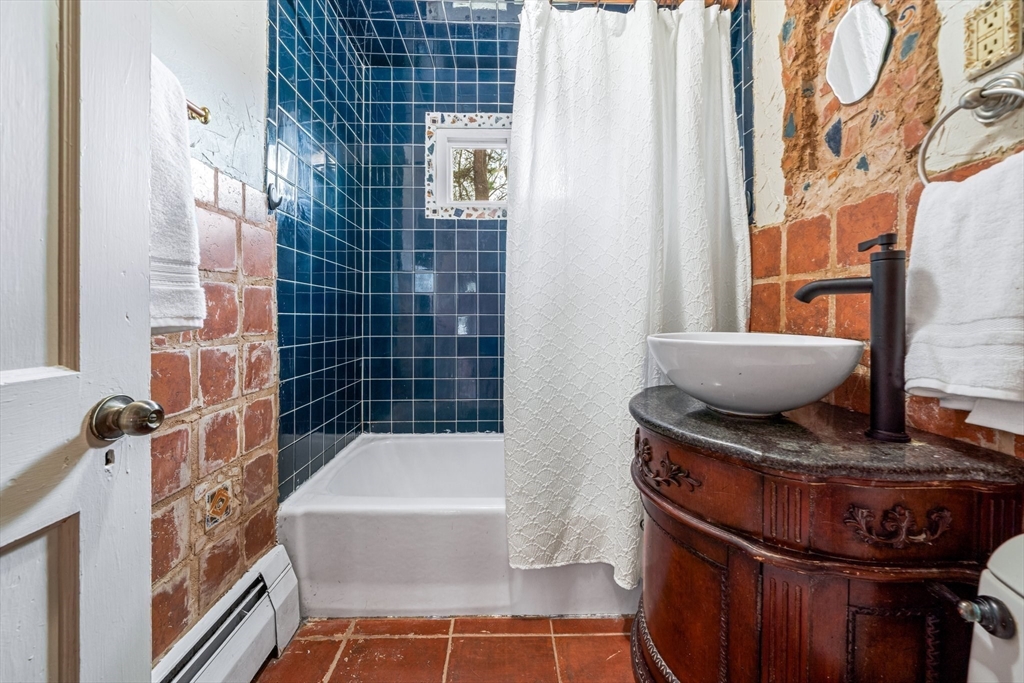 44 Shawsheen Road Billerica, MA 01821 - Photo 21 of 39 a bathroom with a bathtub and a shower