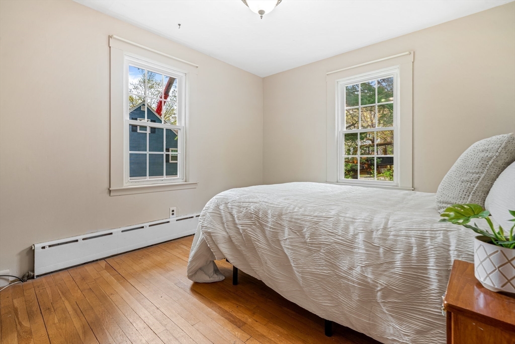 44 Shawsheen Road Billerica, MA 01821 - Photo 24 of 39 a bed sitting in a bedroom next to a window