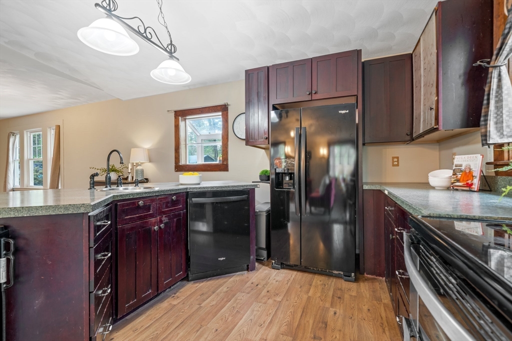 44 Shawsheen Road Billerica, MA 01821 - Photo 25 of 39 a kitchen with granite countertop wooden cabinets and stainless steel appliances