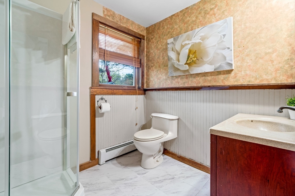 44 Shawsheen Road Billerica, MA 01821 - Photo 31 of 39 a bathroom with a toilet sink and mirror