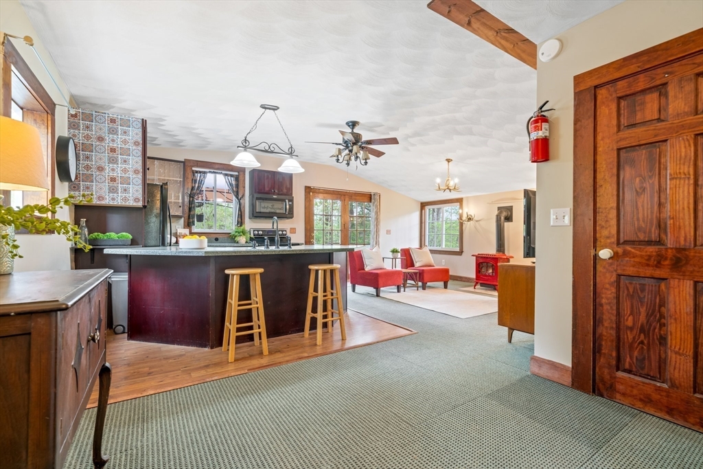 44 Shawsheen Road Billerica, MA 01821 - Photo 9 of 39 a living room with stainless steel appliances furniture a chandelier and a kitchen view
