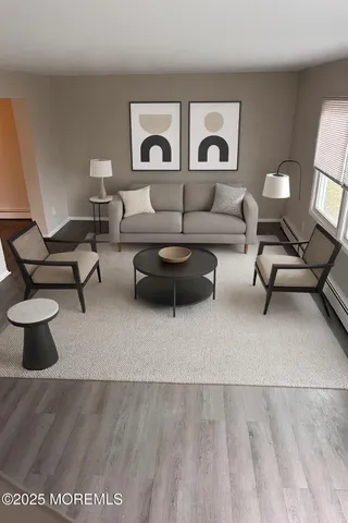 a living room with furniture and a lamp