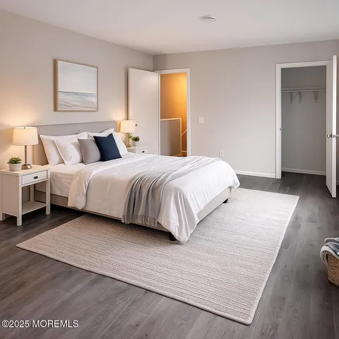 a bedroom with a bed and a night stand