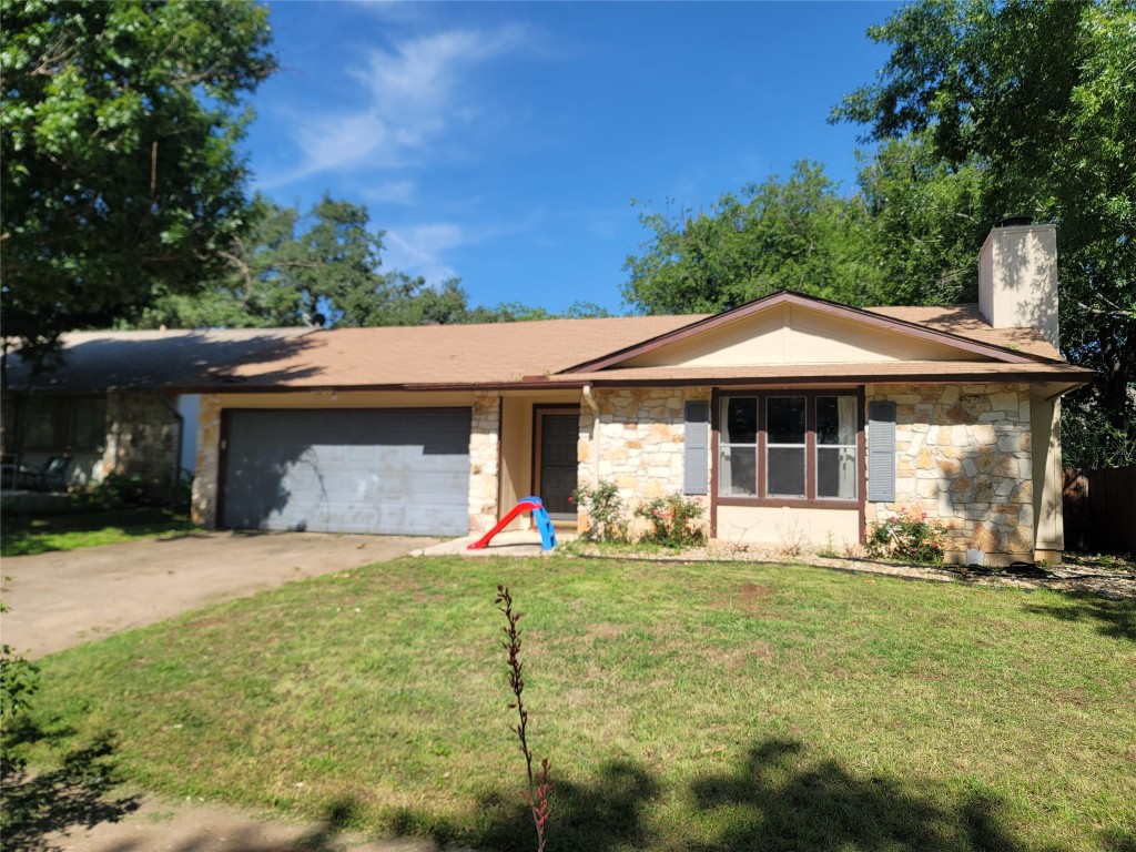 12420 Turtleback Lane Austin, TX 78727 - Photo 1 of 1 a front view of a house with a yard