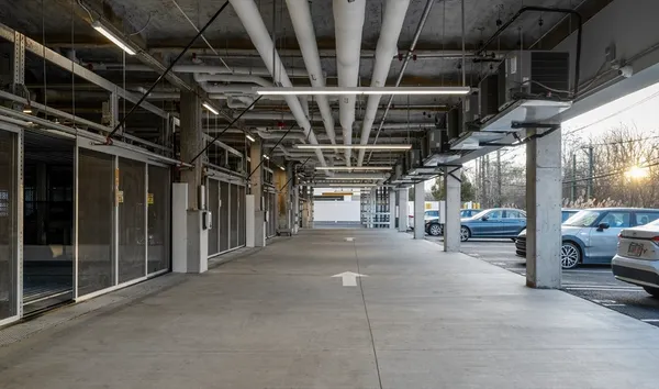 a view of parking garage with cars