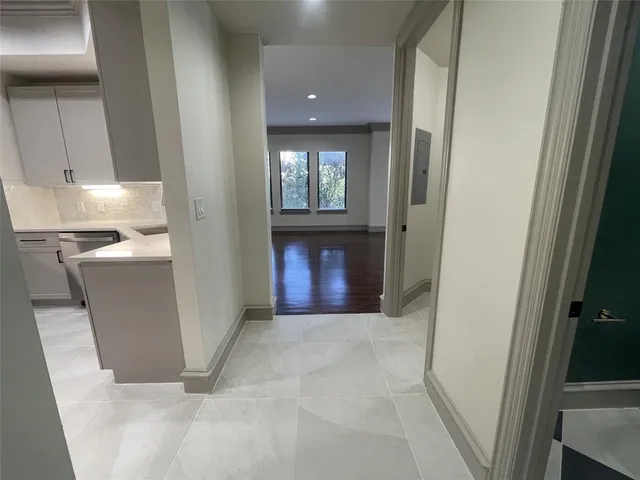 a kitchen with stainless steel appliances granite countertop a sink and a refrigerator