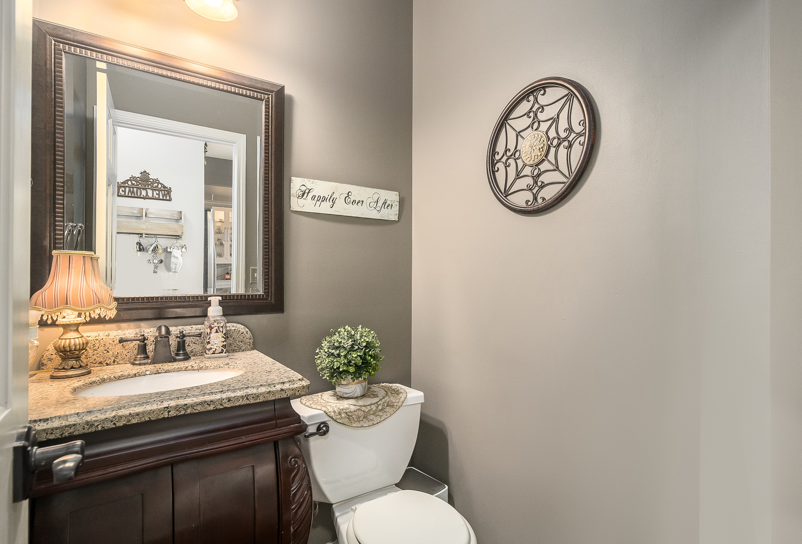 13130 Sunderlin Road Plainfield, IL 60585 - Photo 13 of 33 a bathroom with a toilet a sink and mirror