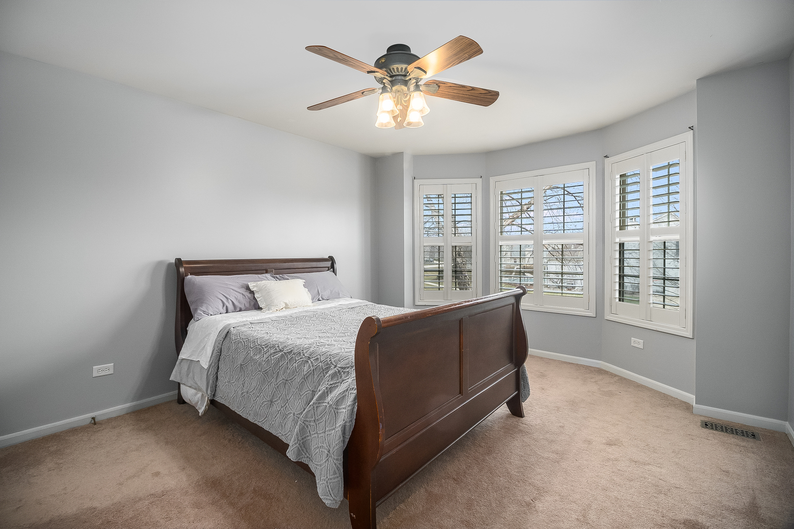 13130 Sunderlin Road Plainfield, IL 60585 - Photo 19 of 33 a bed sitting in a spacious bedroom next to a window