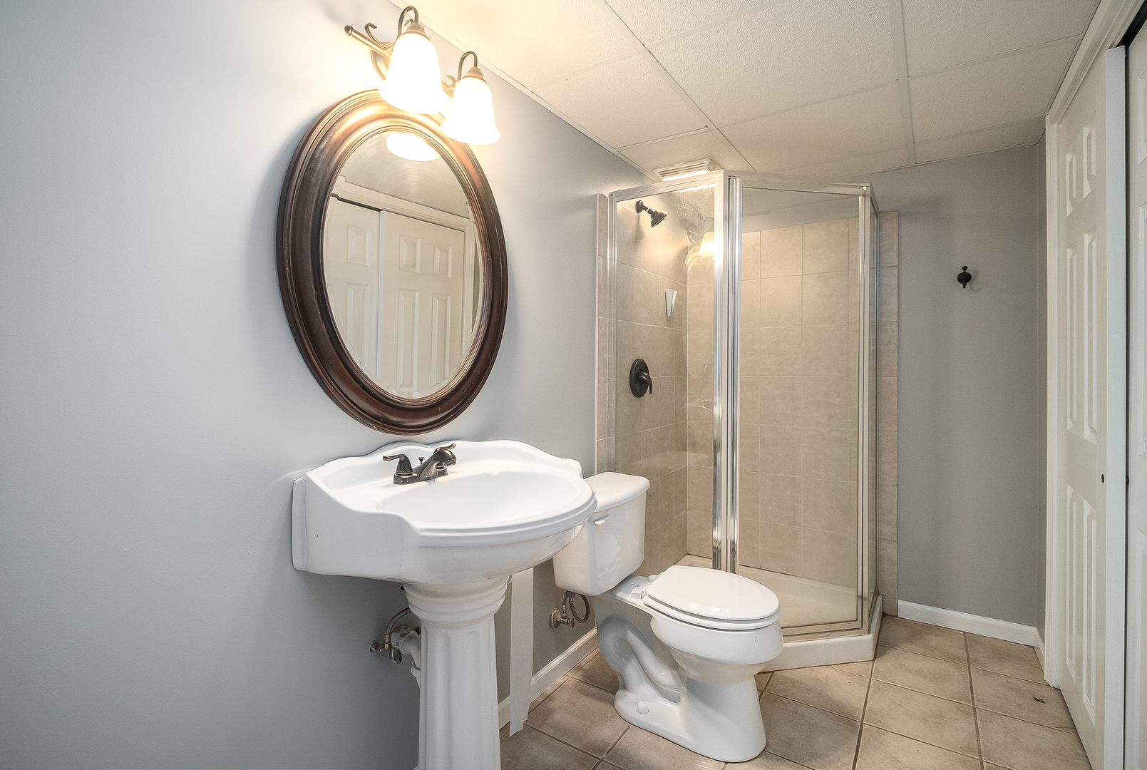 13130 Sunderlin Road Plainfield, IL 60585 - Photo 26 of 33 a bathroom with a sink a toilet and a mirror