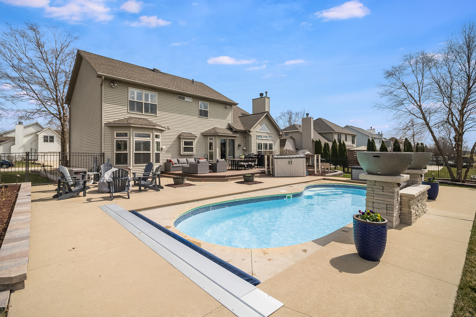 13130 Sunderlin Road Plainfield, IL 60585 - Photo 28 of 33 a view of a swimming pool with outdoor seating