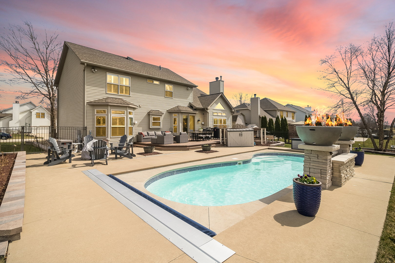 13130 Sunderlin Road Plainfield, IL 60585 - Photo 30 of 33 a view of a swimming pool with a lounge chairs