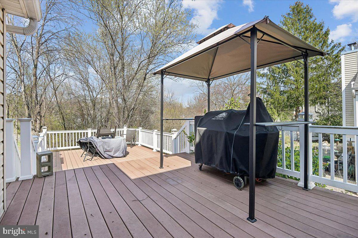 6413 White Peach Place Columbia, MD 21045 - Photo 17 of 31 a view of balcony with wooden floor and iron fence