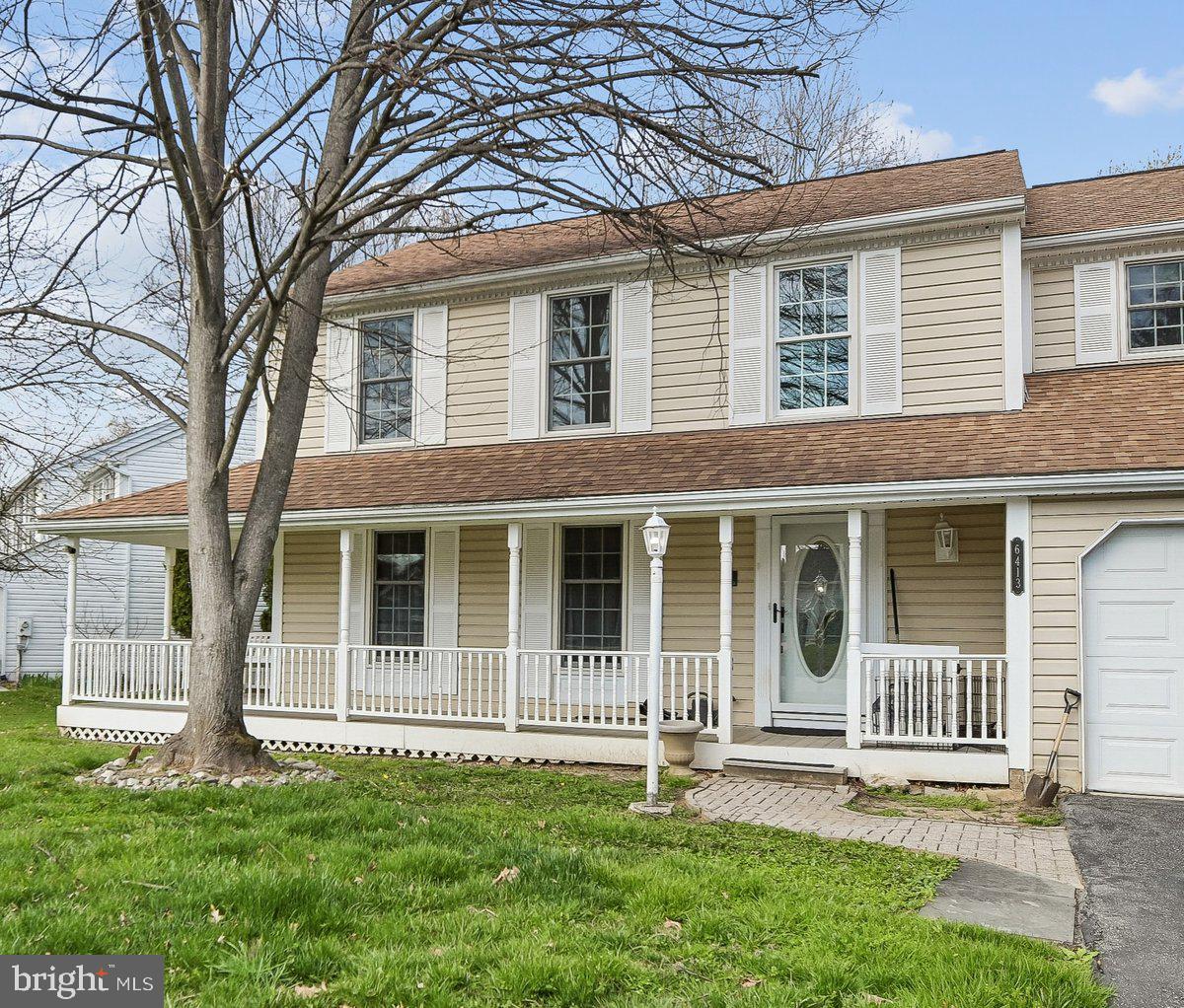 6413 White Peach Place Columbia, MD 21045 - Photo 3 of 31 front view of a house with a yard