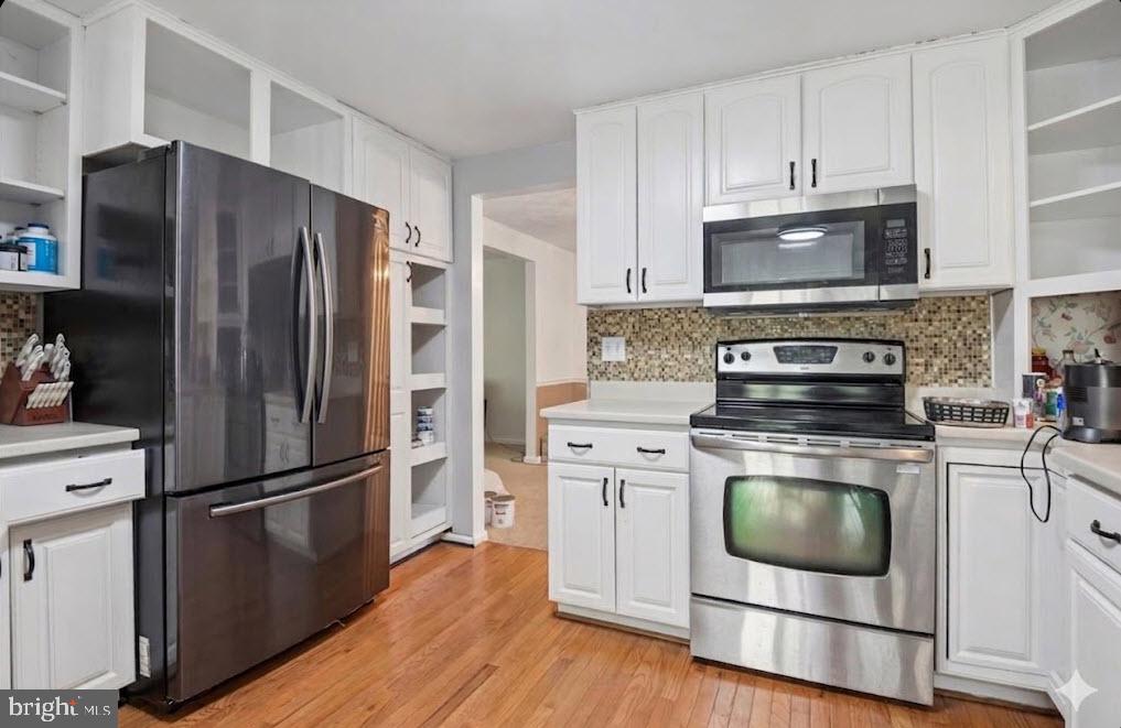 6413 White Peach Place Columbia, MD 21045 - Photo 5 of 31 a kitchen with a refrigerator stove and microwave