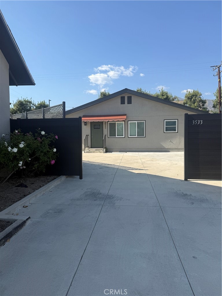 3533 Brandon Street Pasadena, CA 91107 - Photo 1 of 1 a front view of a house with a yard and garage