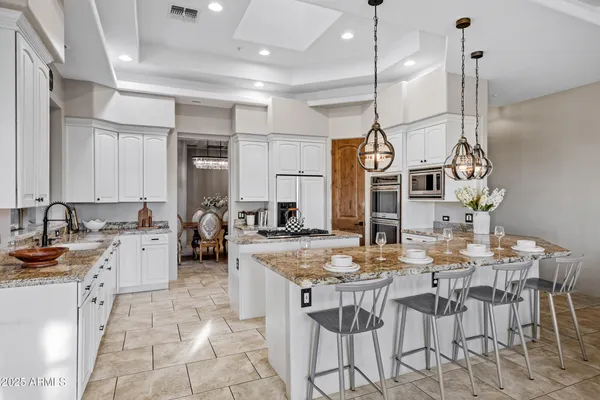a kitchen with a stove a sink and a refrigerator