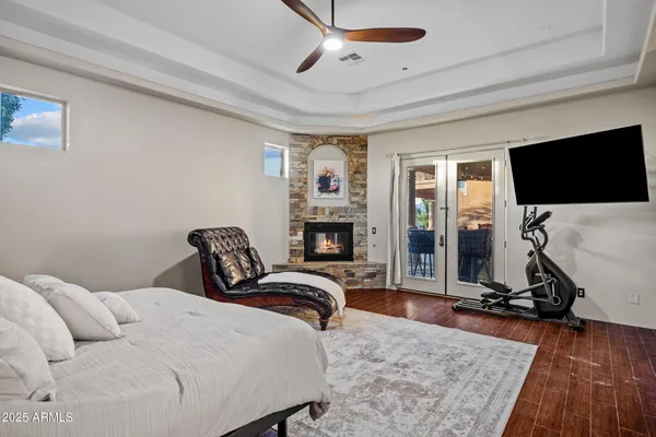 a living room with furniture kitchen view and a flat screen tv