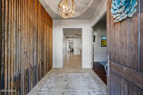 a bedroom with a bed and flat screen tv