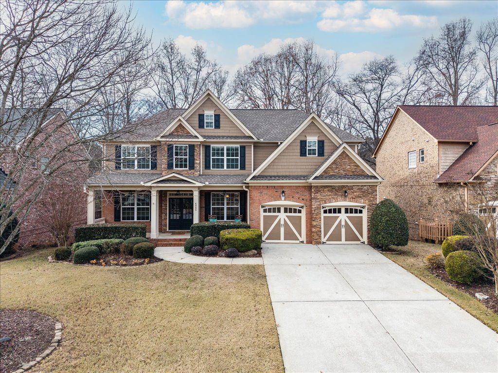 a front view of a house with yard porch and seating space