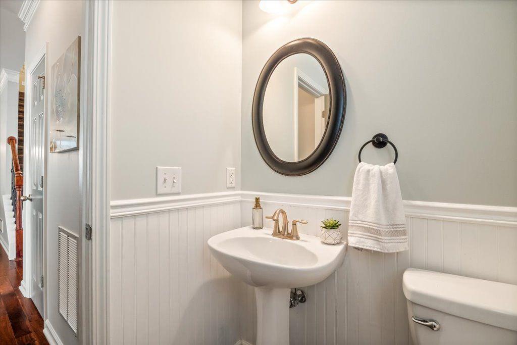 4965 Cheltenham Place Cumming, GA 30041 - Photo 14 of 47 a bathroom with a sink and a mirror