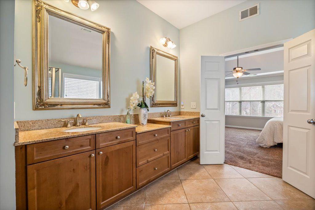 4965 Cheltenham Place Cumming, GA 30041 - Photo 21 of 47 a bathroom with a double vanity sink mirror and
