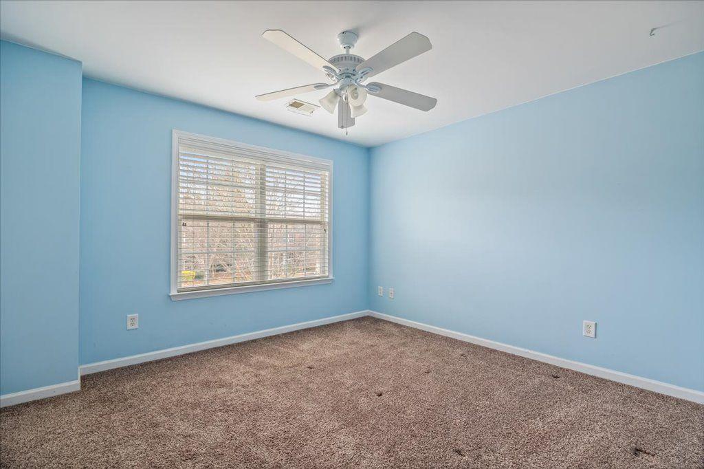 4965 Cheltenham Place Cumming, GA 30041 - Photo 23 of 47 an empty room with fan and windows