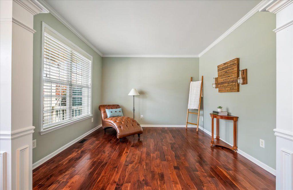 4965 Cheltenham Place Cumming, GA 30041 - Photo 3 of 47 a living room with furniture and wooden floor