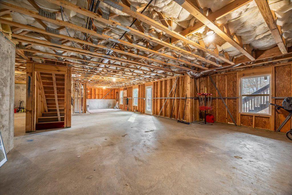 4965 Cheltenham Place Cumming, GA 30041 - Photo 31 of 47 a view of an empty room with wooden walls