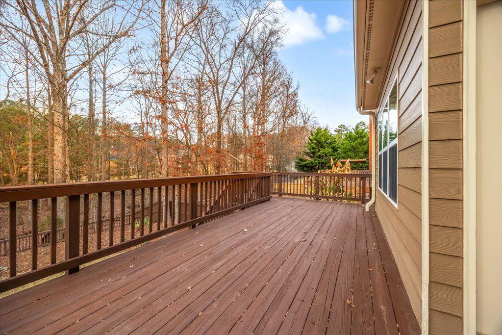 4965 Cheltenham Place Cumming, GA 30041 - Photo 33 of 47 a view of balcony with wooden floor and fence