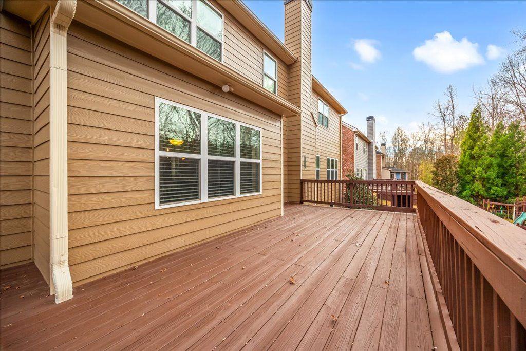 4965 Cheltenham Place Cumming, GA 30041 - Photo 34 of 47 a view of a balcony with wooden floor