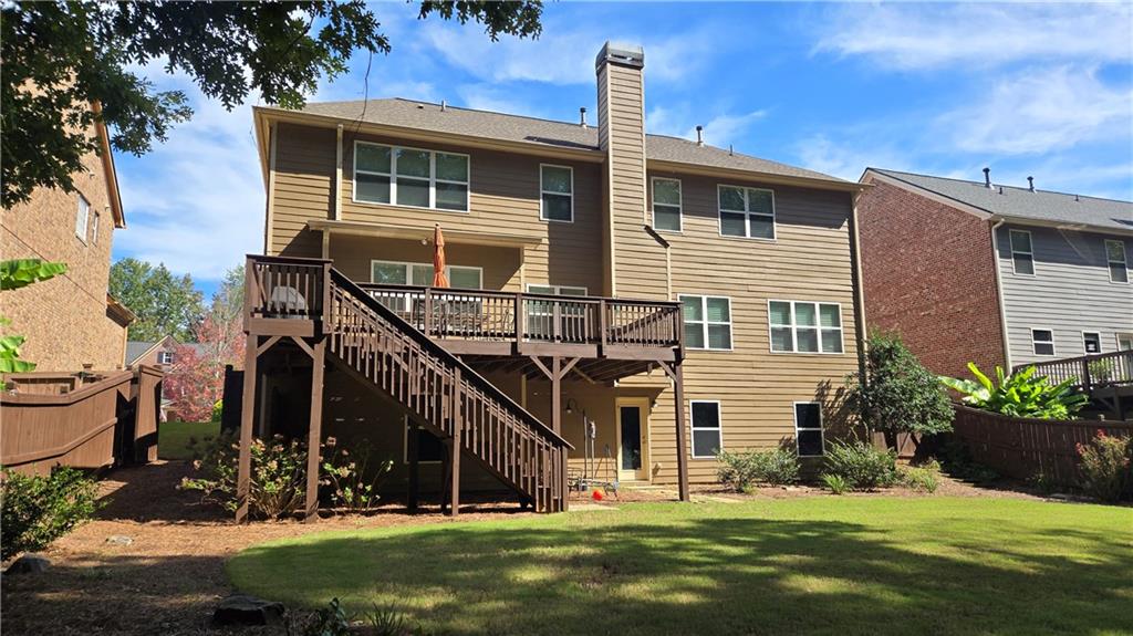 4965 Cheltenham Place Cumming, GA 30041 - Photo 35 of 47 a view of a house with backyard