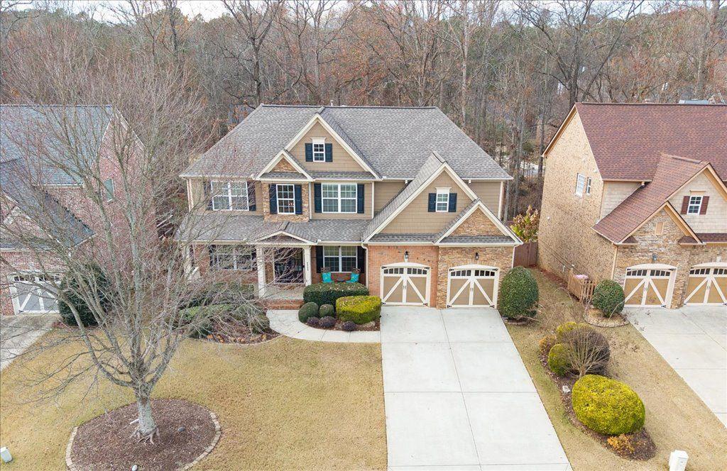 4965 Cheltenham Place Cumming, GA 30041 - Photo 38 of 47 a front view of a house with garden
