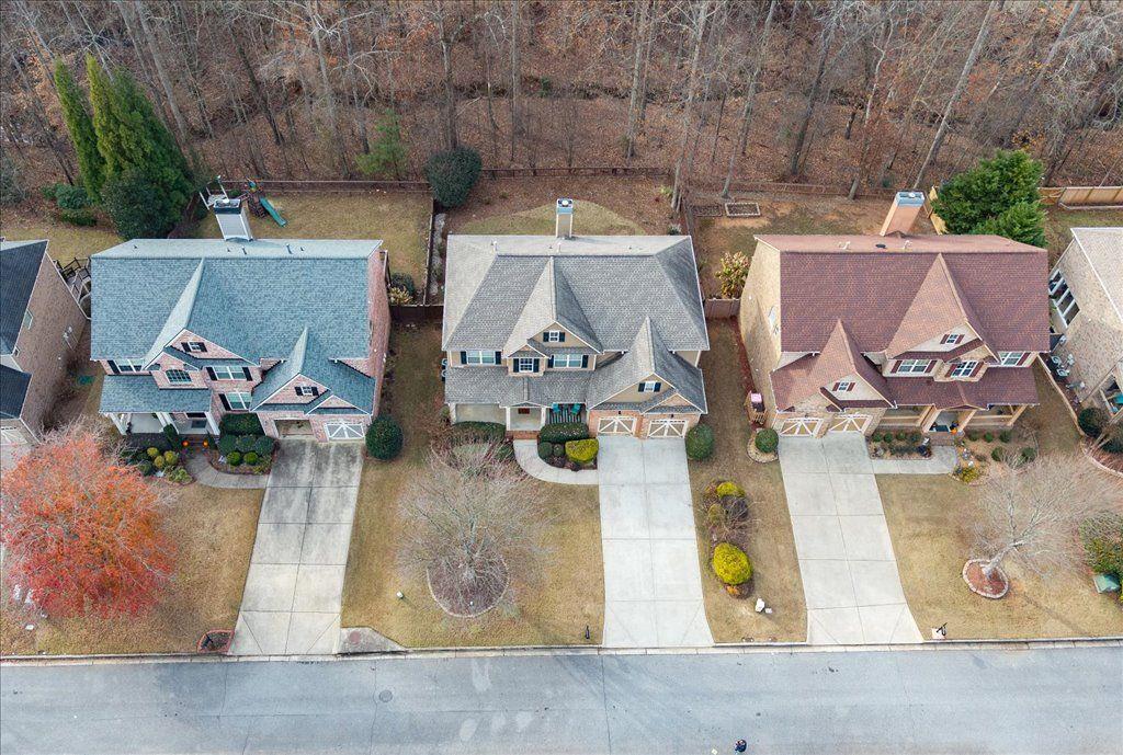 4965 Cheltenham Place Cumming, GA 30041 - Photo 40 of 47 an aerial view of residential houses with outdoor space