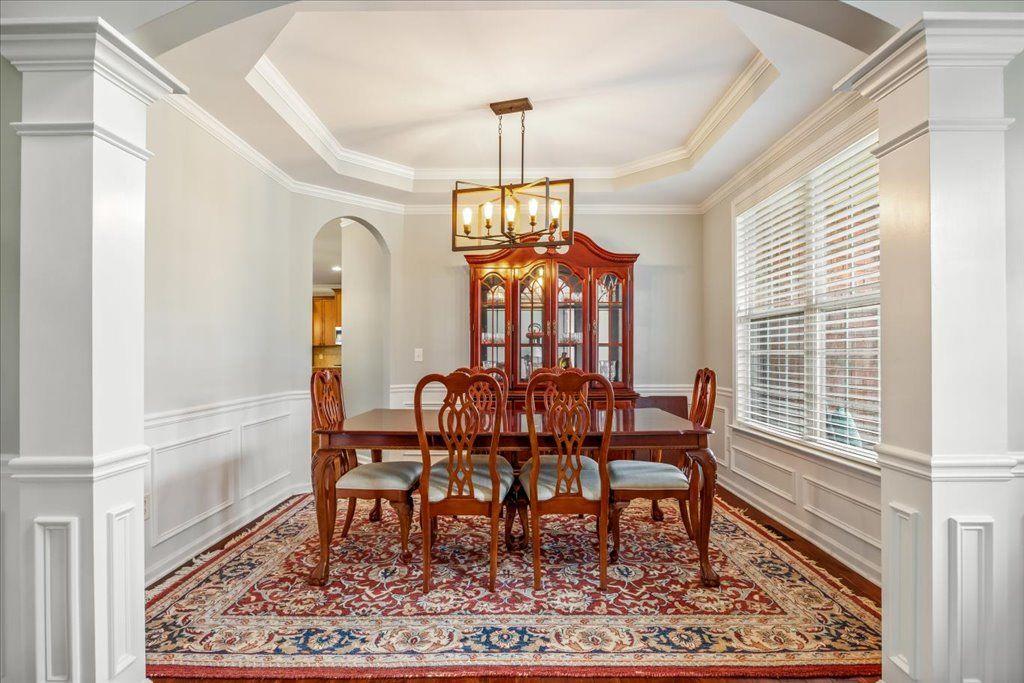 4965 Cheltenham Place Cumming, GA 30041 - Photo 4 of 47 a view of a dining room with furniture window and wooden floor