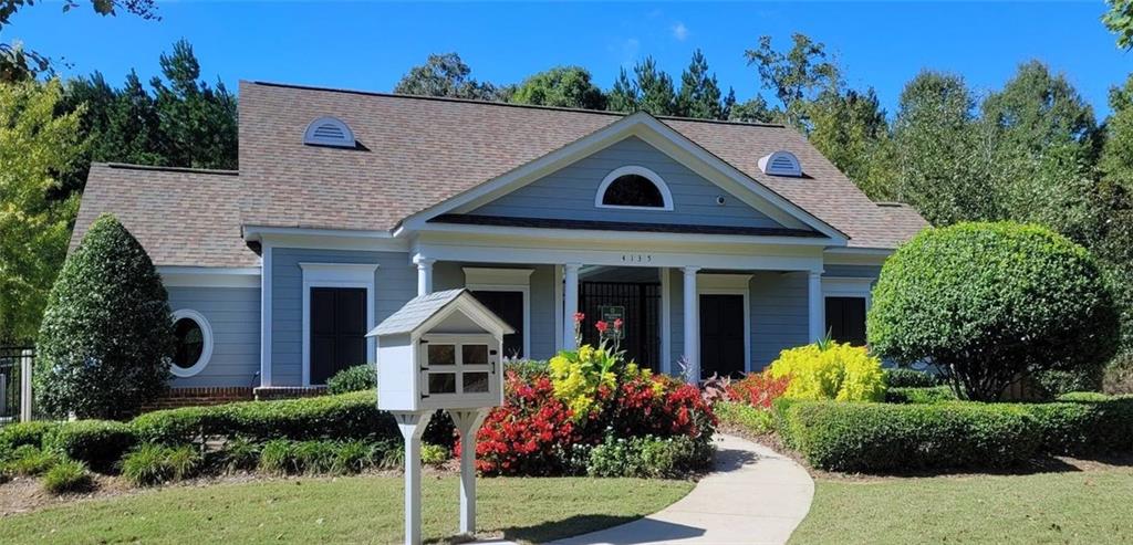 4965 Cheltenham Place Cumming, GA 30041 - Photo 42 of 47 a front view of a house with a yard