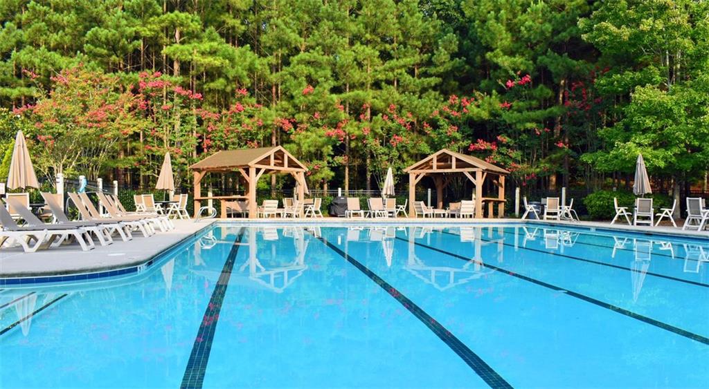 4965 Cheltenham Place Cumming, GA 30041 - Photo 44 of 47 a house view with a swimming pool