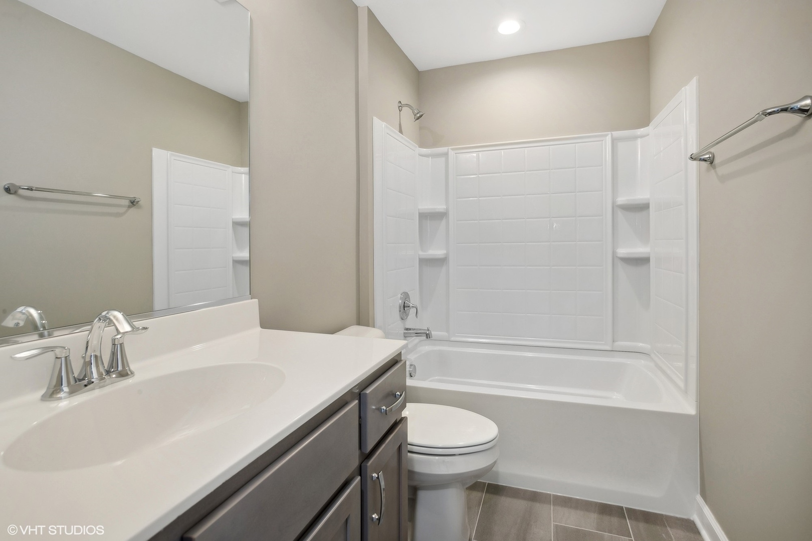 253 Masters Drive Addison, IL 60101 - Photo 12 of 17 a bathroom with a sink a toilet and shower