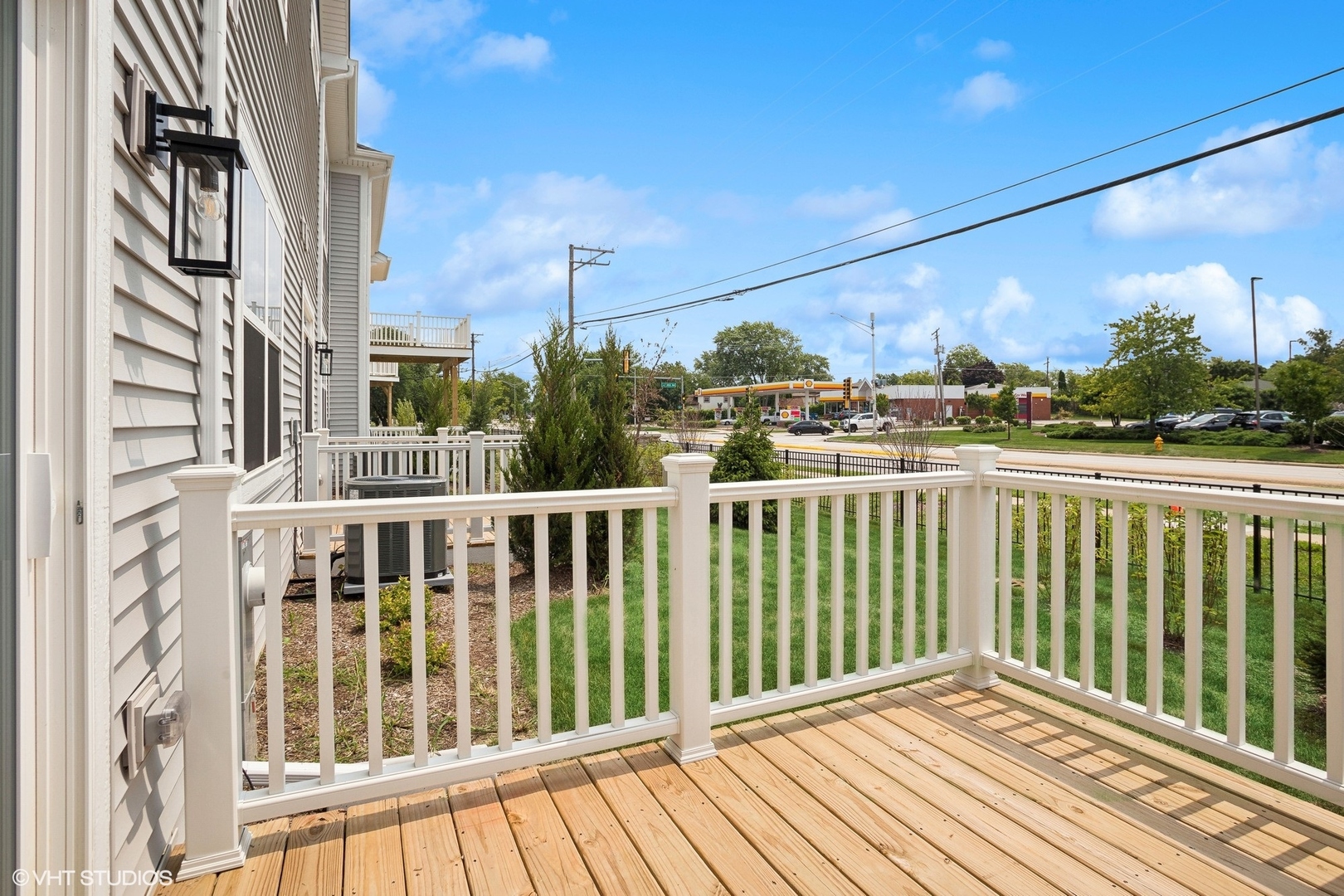 253 Masters Drive Addison, IL 60101 - Photo 14 of 17 a view of a balcony with wooden floor
