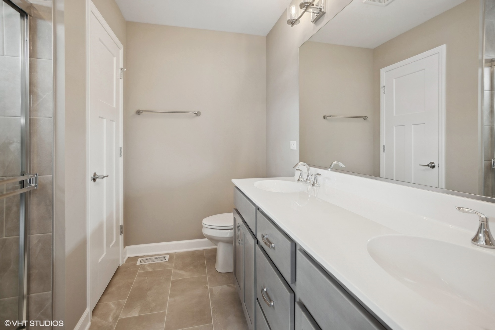 253 Masters Drive Addison, IL 60101 - Photo 10 of 17 a bathroom with a sink toilet and vanity