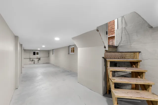 a view of a kitchen with furniture and an empty room